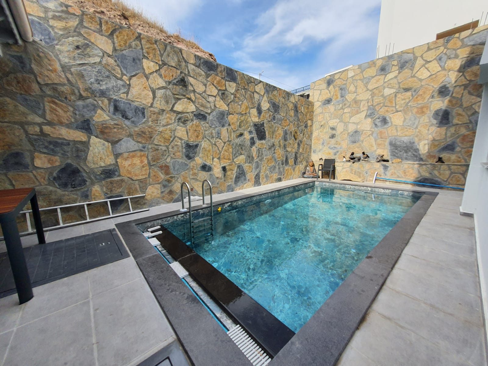 Villa Huzur private pool with natural stone surround – Akyarlar Bodrum